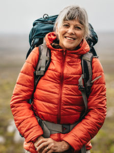 Female hiker standing on a hill
